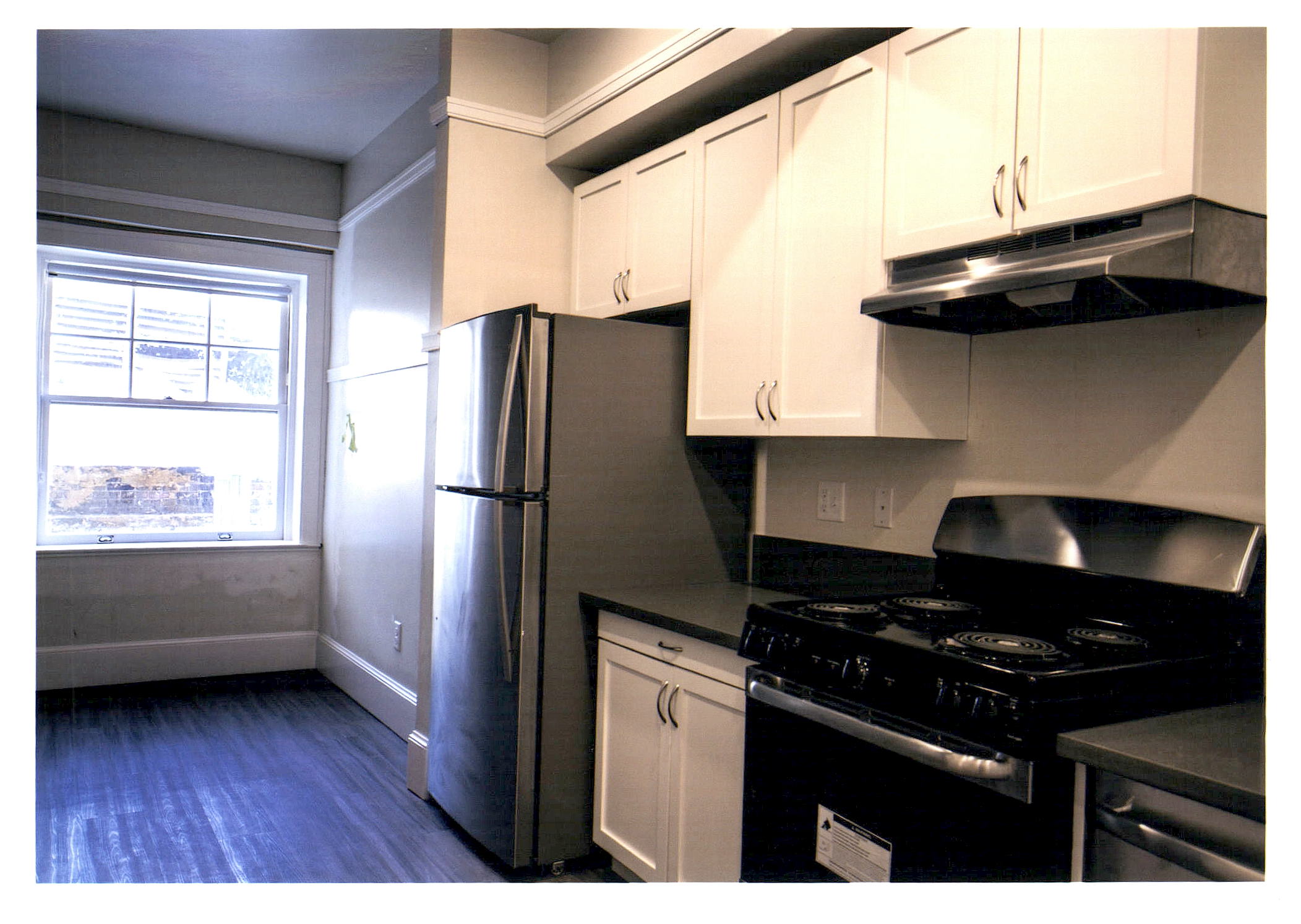 After: view of new kitchen and appliances.